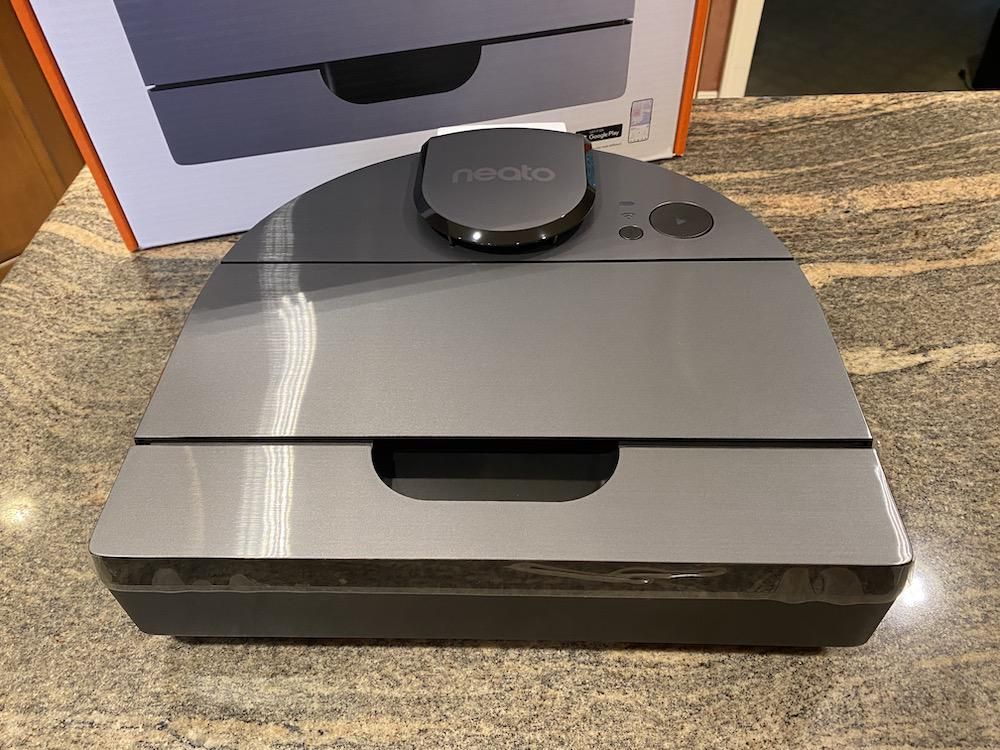 Neato D10 Smart Robot Vacuum Cleaner on a. countertop