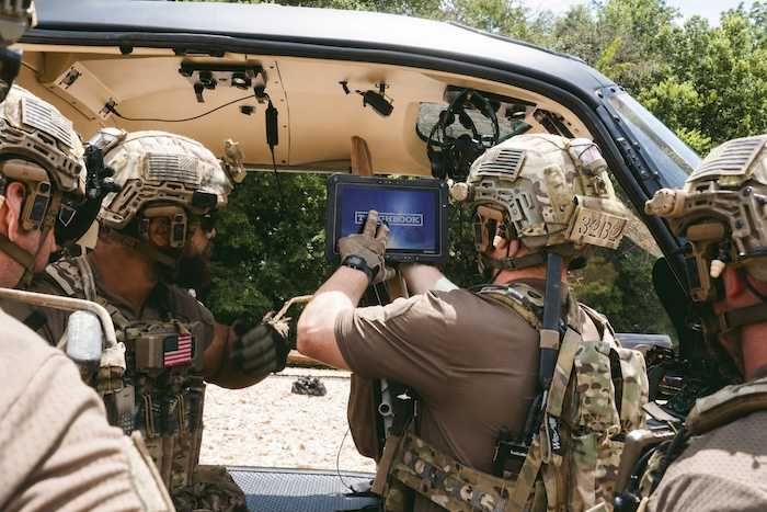 a photo of government workers using Toughbook G34 in a vehicle.