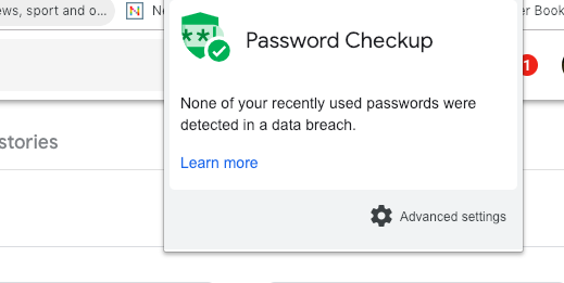 A green badge symbol for Password Checkup on a computer screen