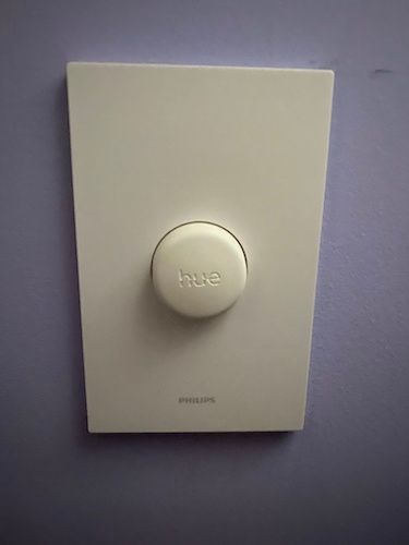 photo of philips hue smart button on the wall