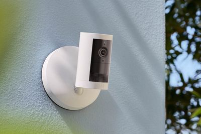 Ring Outdoor Cam Plus Security Camera on the side of a house photo