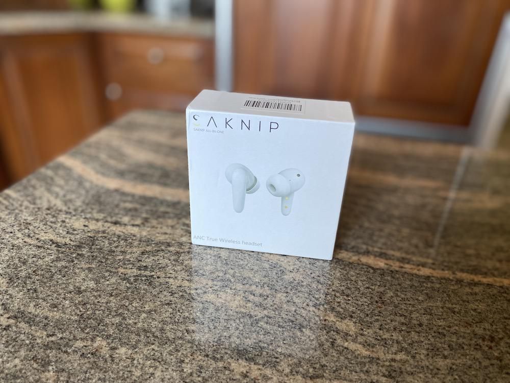 Photo of Saknip earbuds box on a countertop