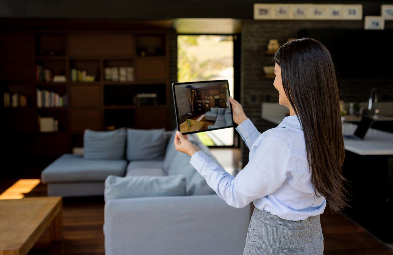 a photo of Real estate agent making a virtual showing of a house for sale