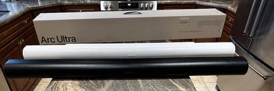a photo of Sonos Arc and Arc Ultra Soundbars on a counter