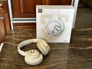 a photo of SoundPEATS Space Over-the-Ears ANC Headphones  and box on a countertop.