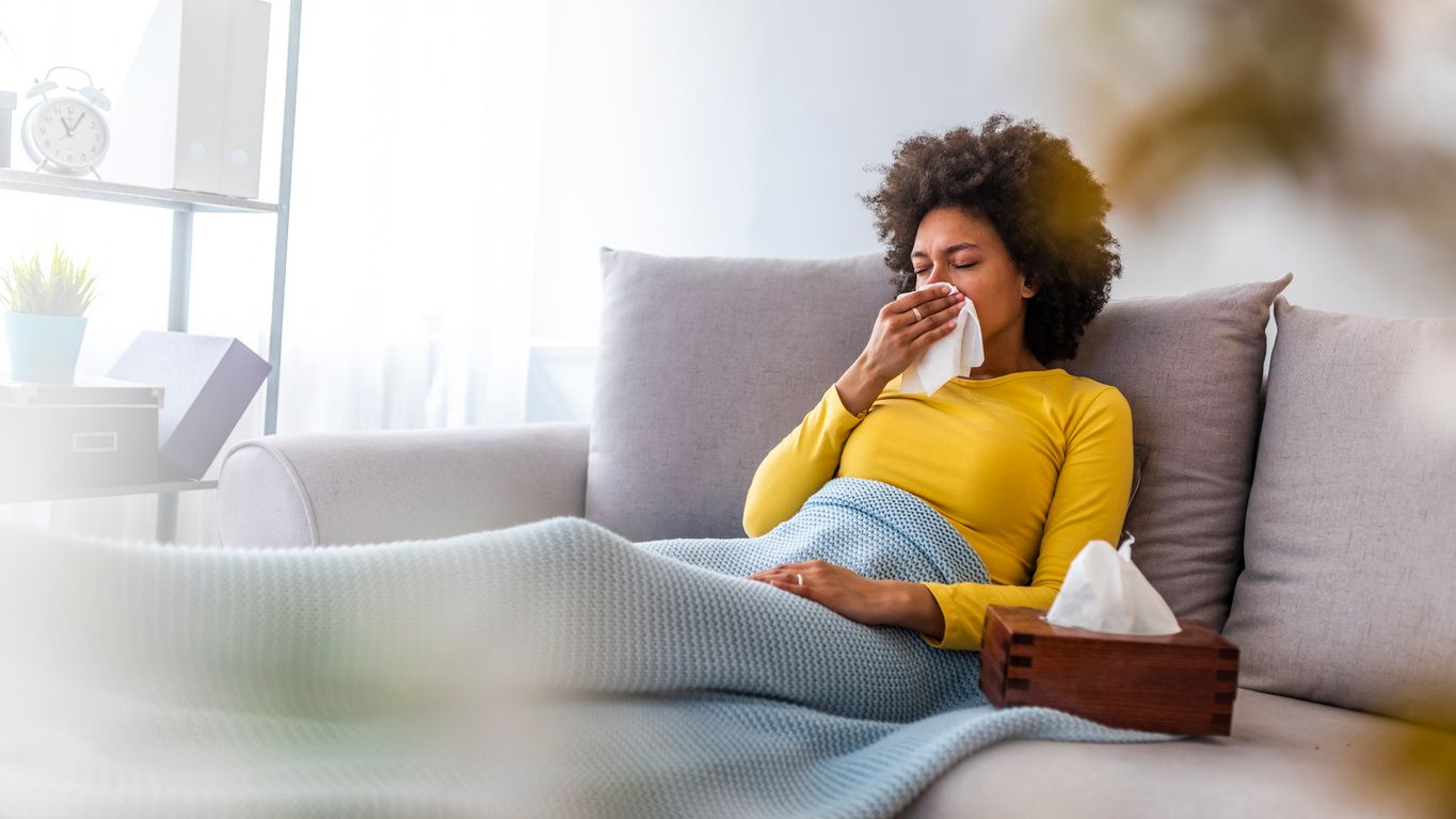 Stock image of a woman with the flu