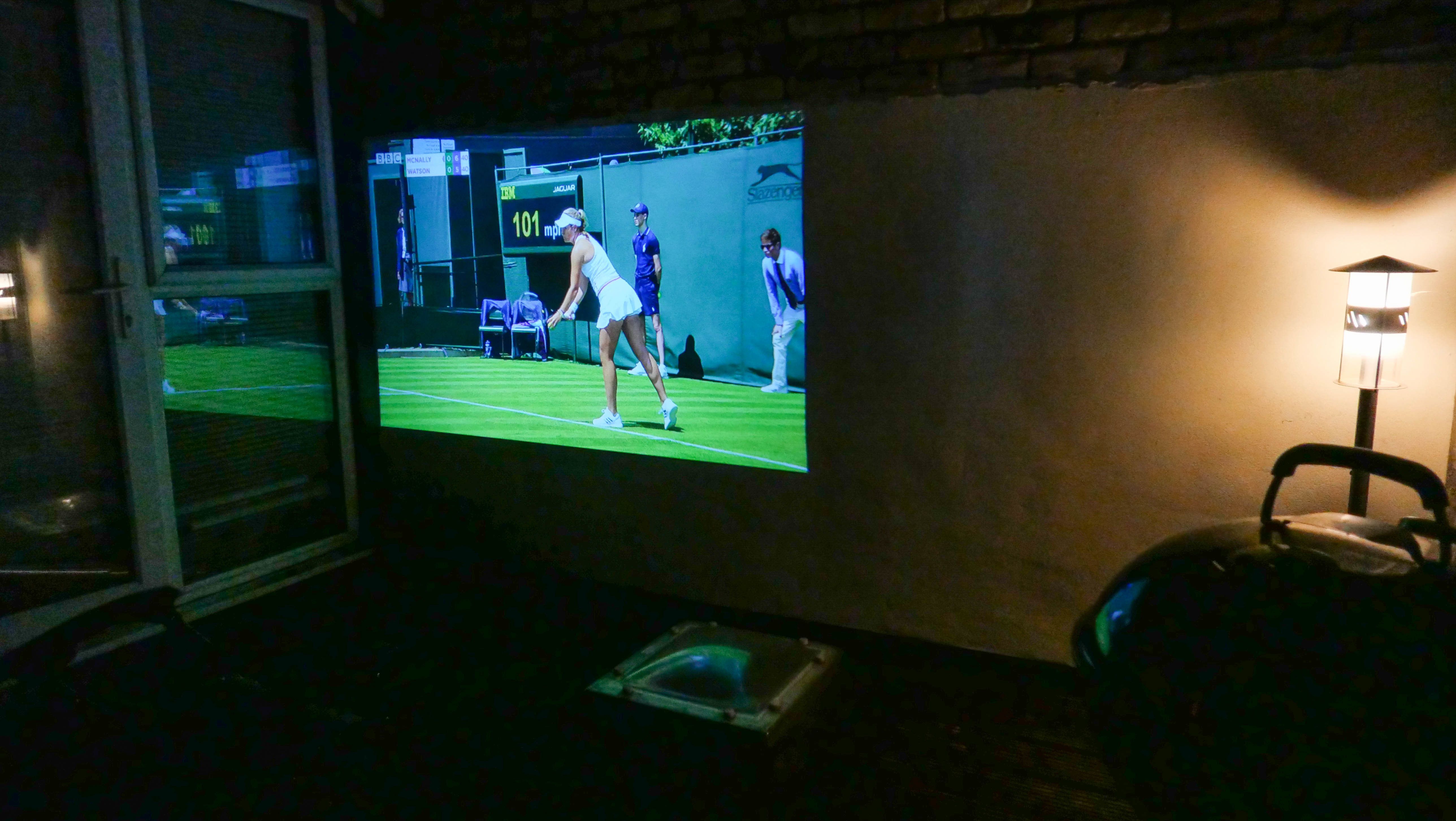 Photo of a projector working on an outside roof terrace