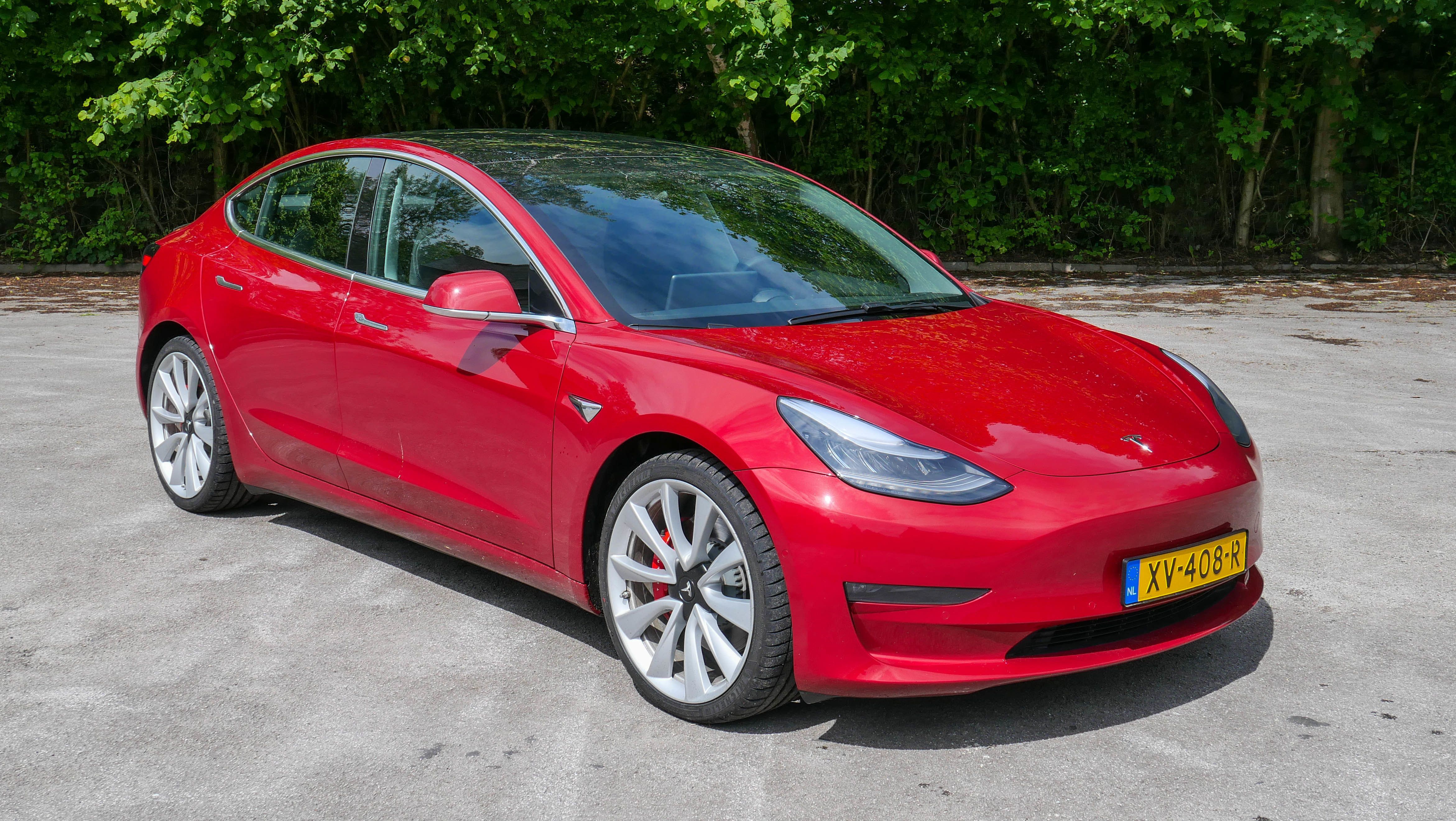 Photo of a red Tesla Model 3