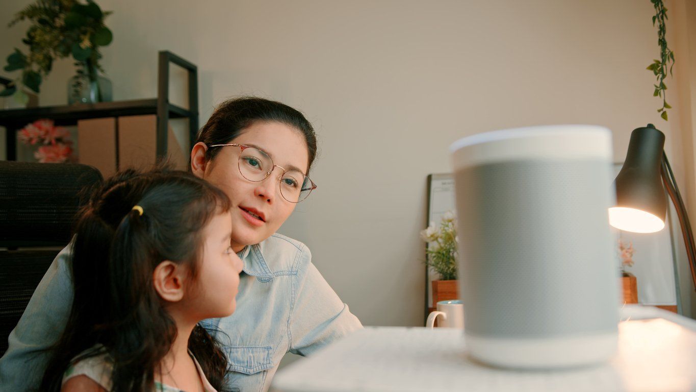  Asian Mother and Daughter Bonding While Working from Home stock photo