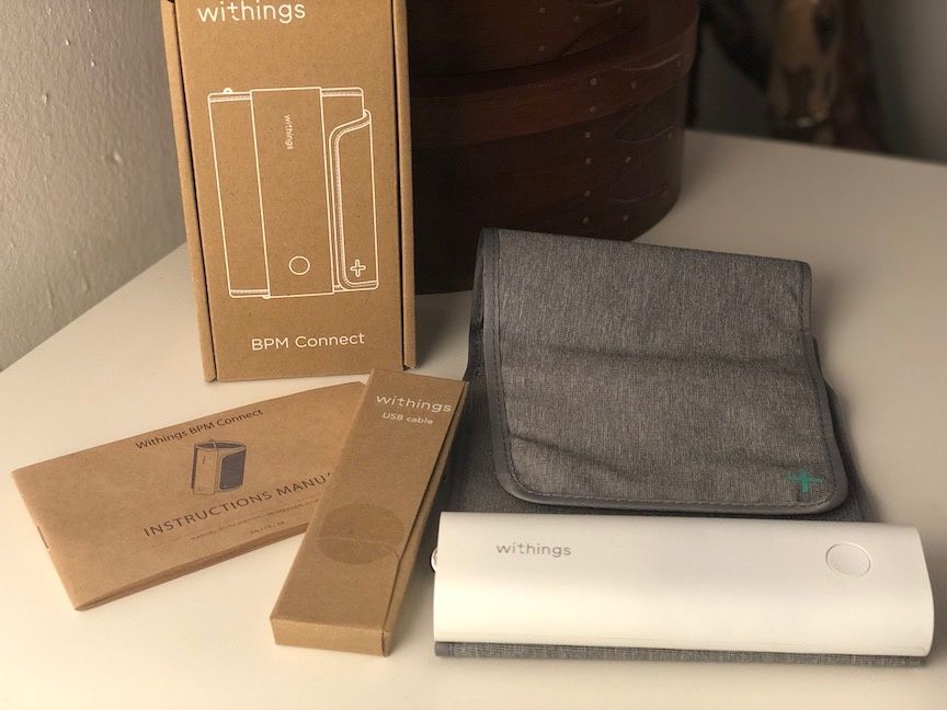 The Withings BPM Connect monitor, cuff, instruction manual and USB cable