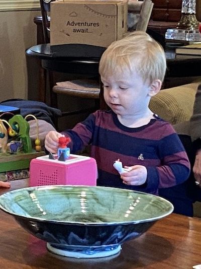 A boy testing Tonies on toniebox