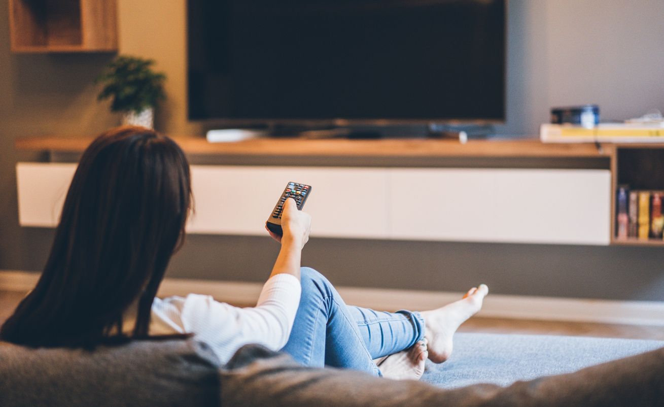 Stock image of a woman watching TV