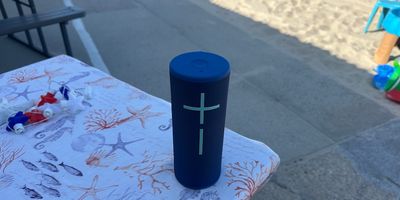 photo of Boom 4 speaker on a table at the beach