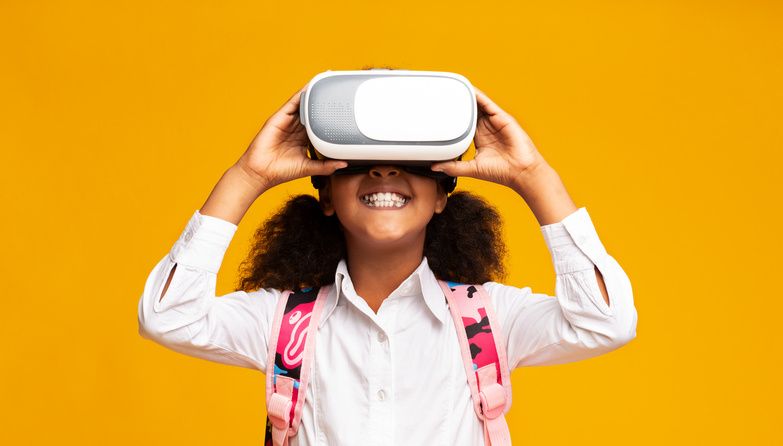 A young child trying a VR headset