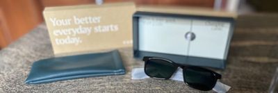 Photo of Vue Lite 2 Smart Audio Sunglasses unboxed on a countertop.