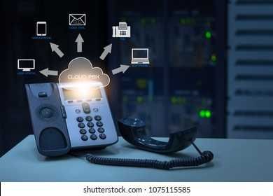 IP Telephony cloud pbx concept, telephone device with illustration icon of voip services and networking data center on background Stock Photo