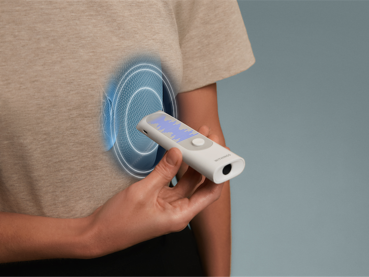 a photo of a woman using Withings BeamO on her body