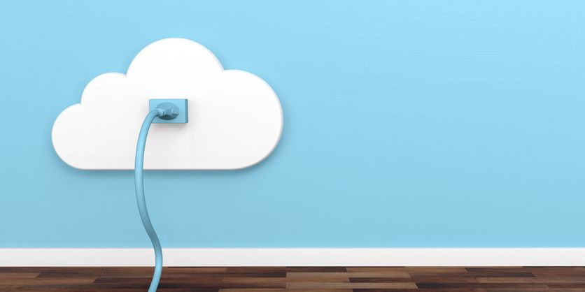 A smart plug on a blue wall