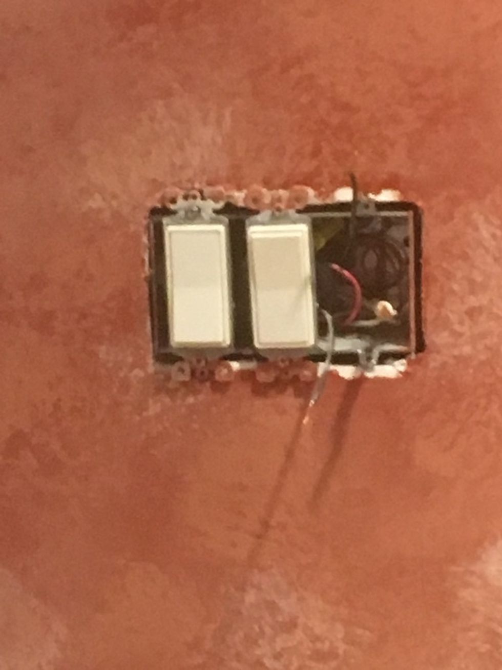 Light switches in a wall.