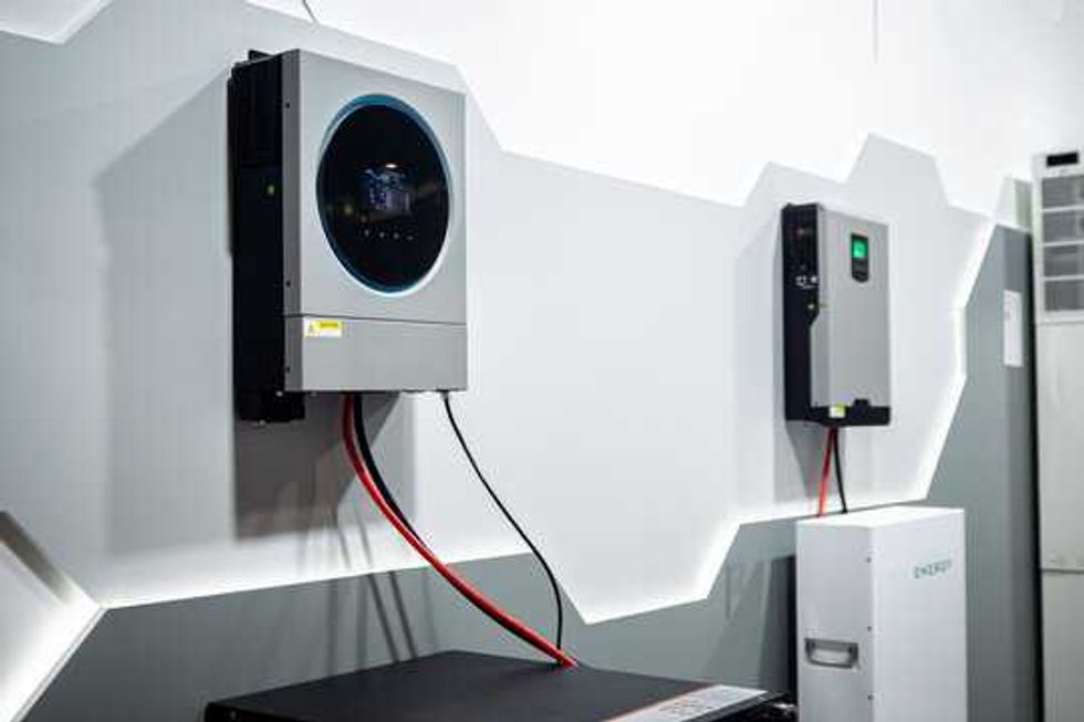 Modern solar power inverter and energy storage system with clean wiring, showcasing advanced renewable energy technology for sustainable homes and businesses. High-tech equipment for efficient power m