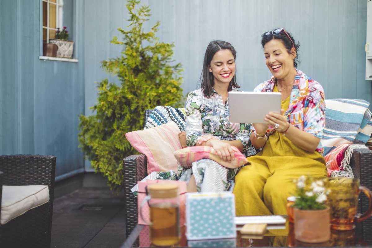 Mom and daughter buying gifts online together