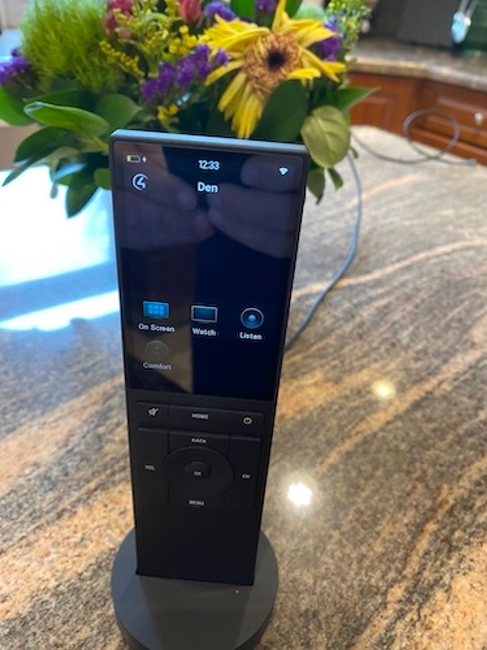 Neeo remote control powering up on a counter.