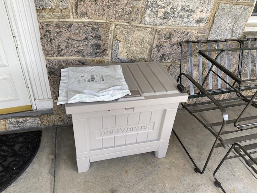 Package placed to top of Yale Smart Delivery Box