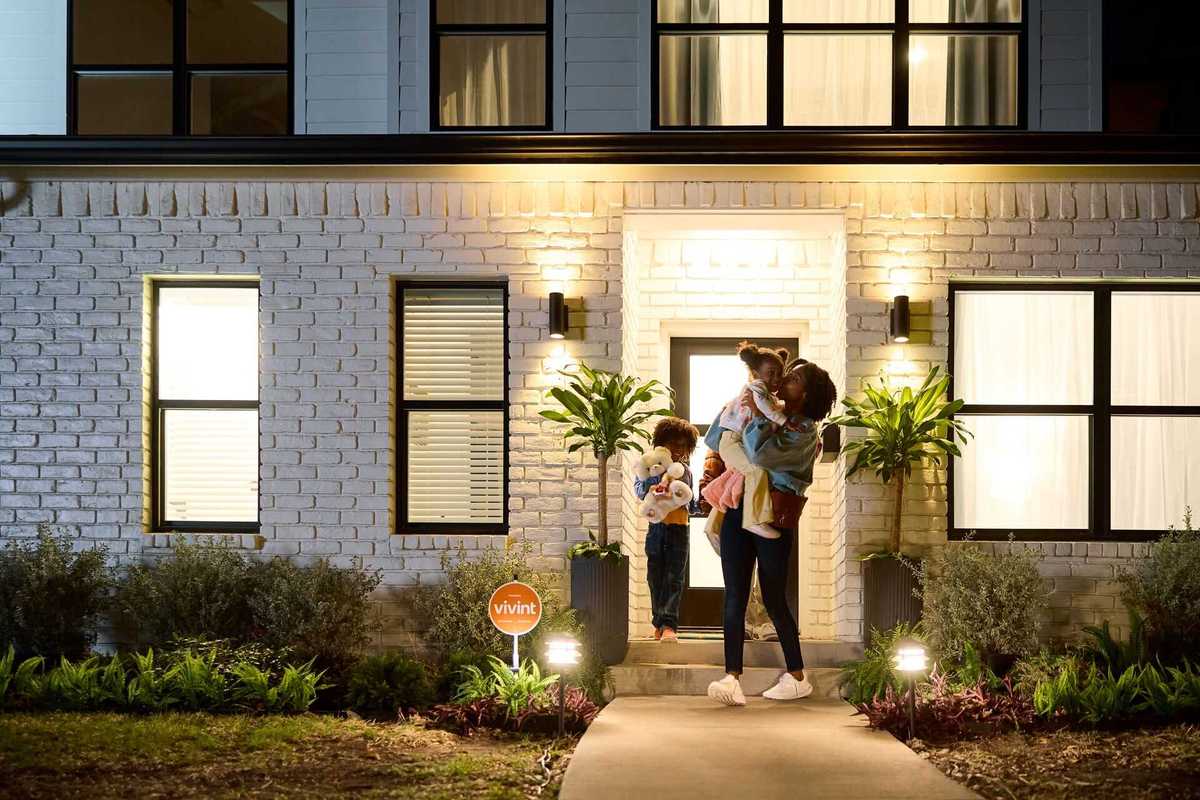 photo of a family out in front of their home.