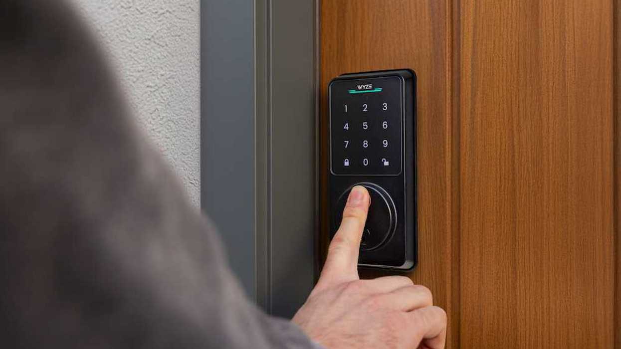 photo of a person using their finger to open Wyze lock bolt v2