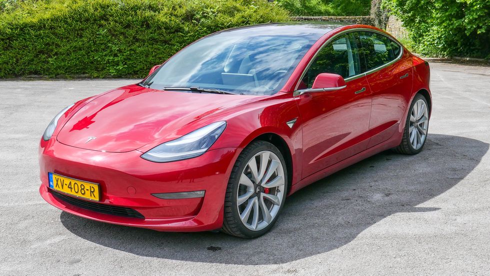 Photo of a red Tesla Model 3 Performance