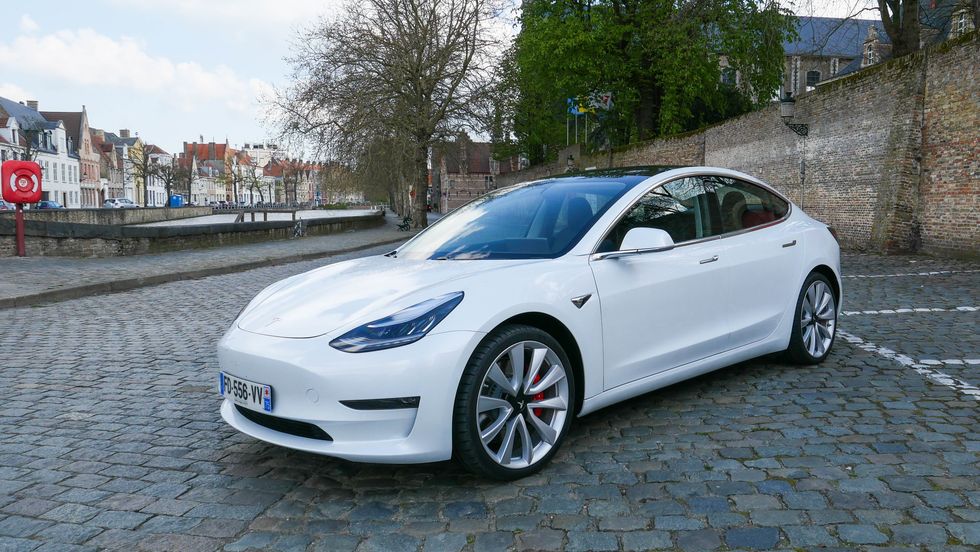 Photo of a white Tesla Model 3 Performance