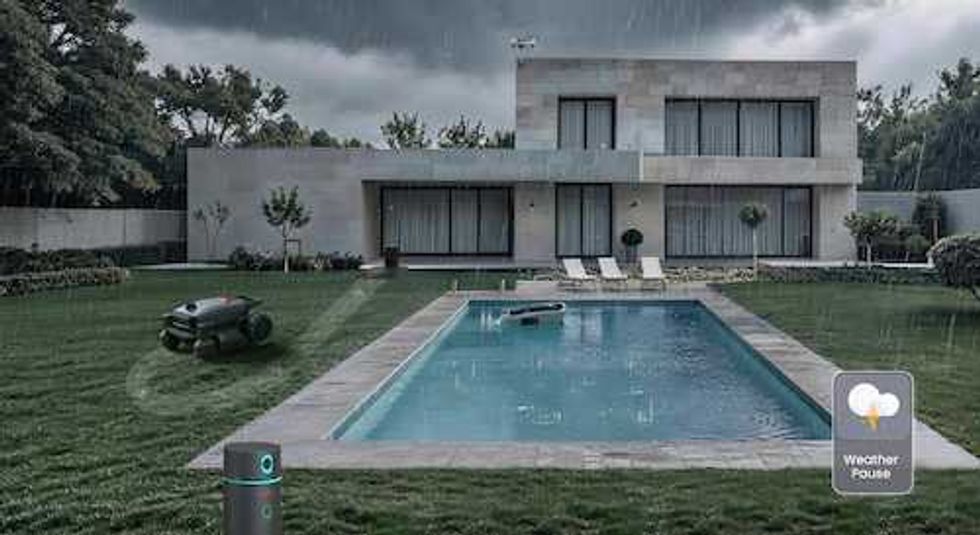 photo of a yard with Aiper Smart Yard Ecosystem at work in the rain