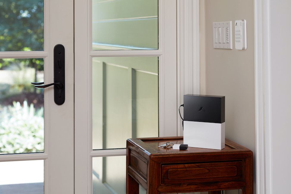 photo of abode smart security kit on a table with key fob