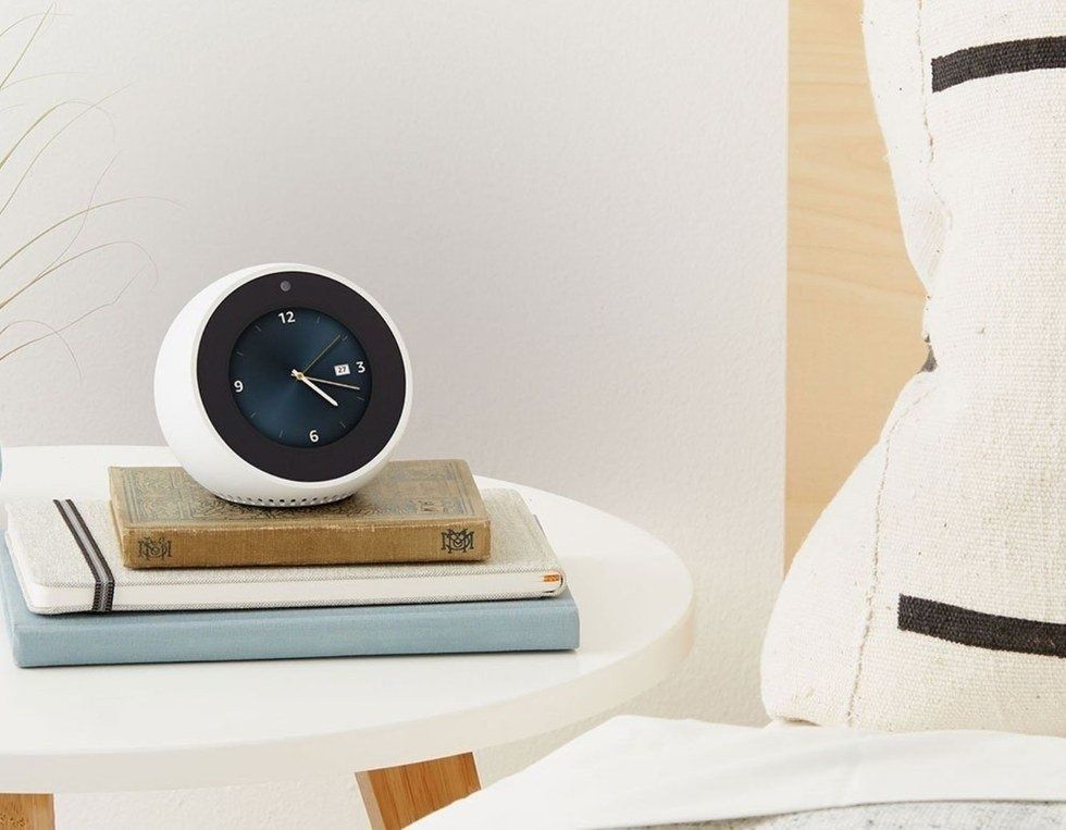 Photo of amazon echo spot on a night stand.