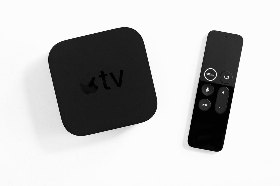 Photo of an Apple TV streaming box and remote control