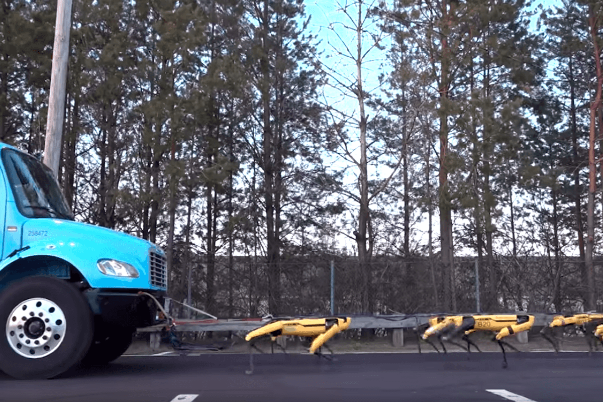 Photo of Boston Dynamics robots pulling a truck