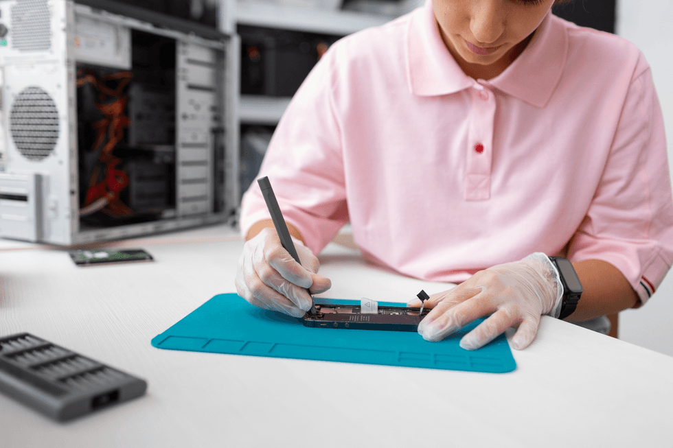 photo of close-up-woman-repairing-computer-chips