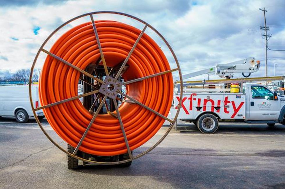 photo of Comcast workers installing fiber network.