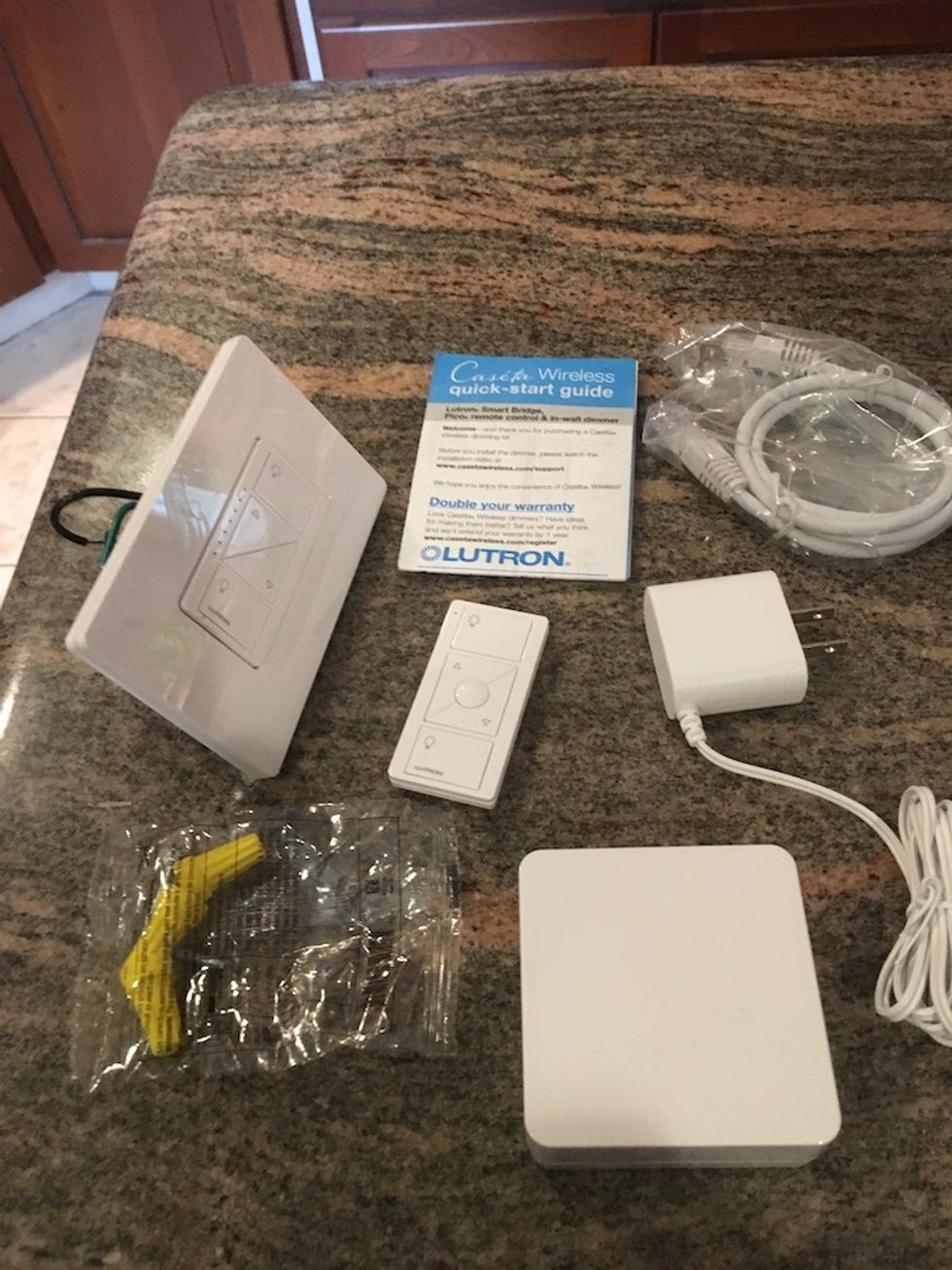 Photo of contents inside Lutron Caseta Dimmer Kit with Smart Bridge