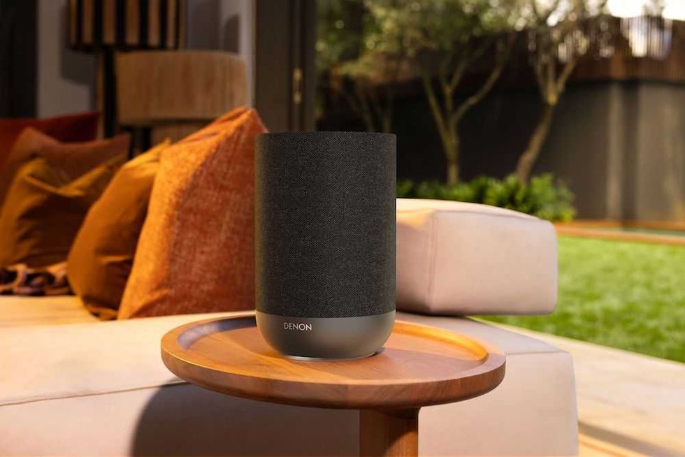 photo of Denon Home 200 speaker on a table outside