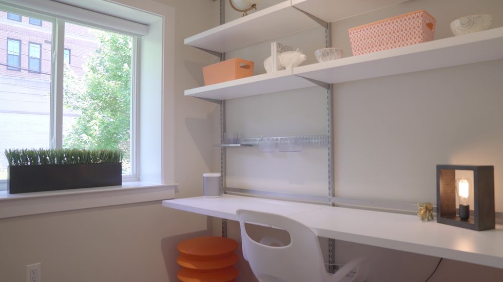 Photo of desk with smart speaker in Alarm.com Demo House