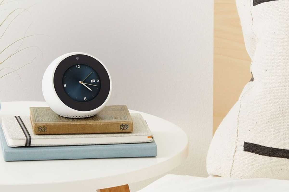 Photo of Echo Spot ontop of books on a nightstand