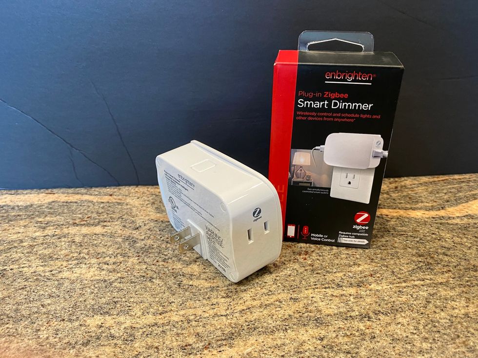 photo of enbrighten smart dimmer and box on a counter.