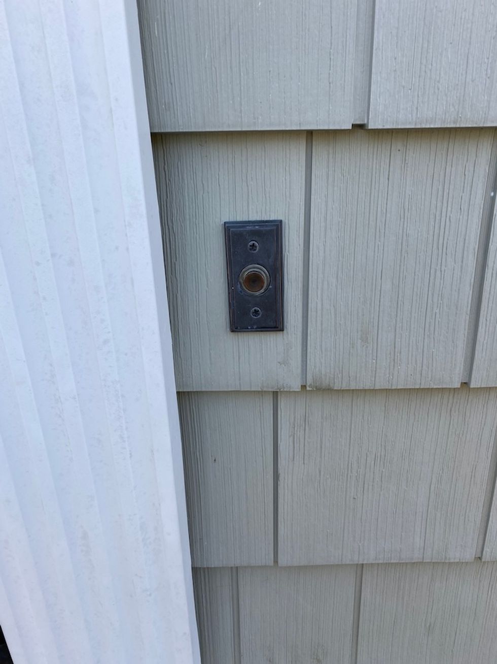 Photo of existing wired doorbell which you need to turn off the power to before removing.