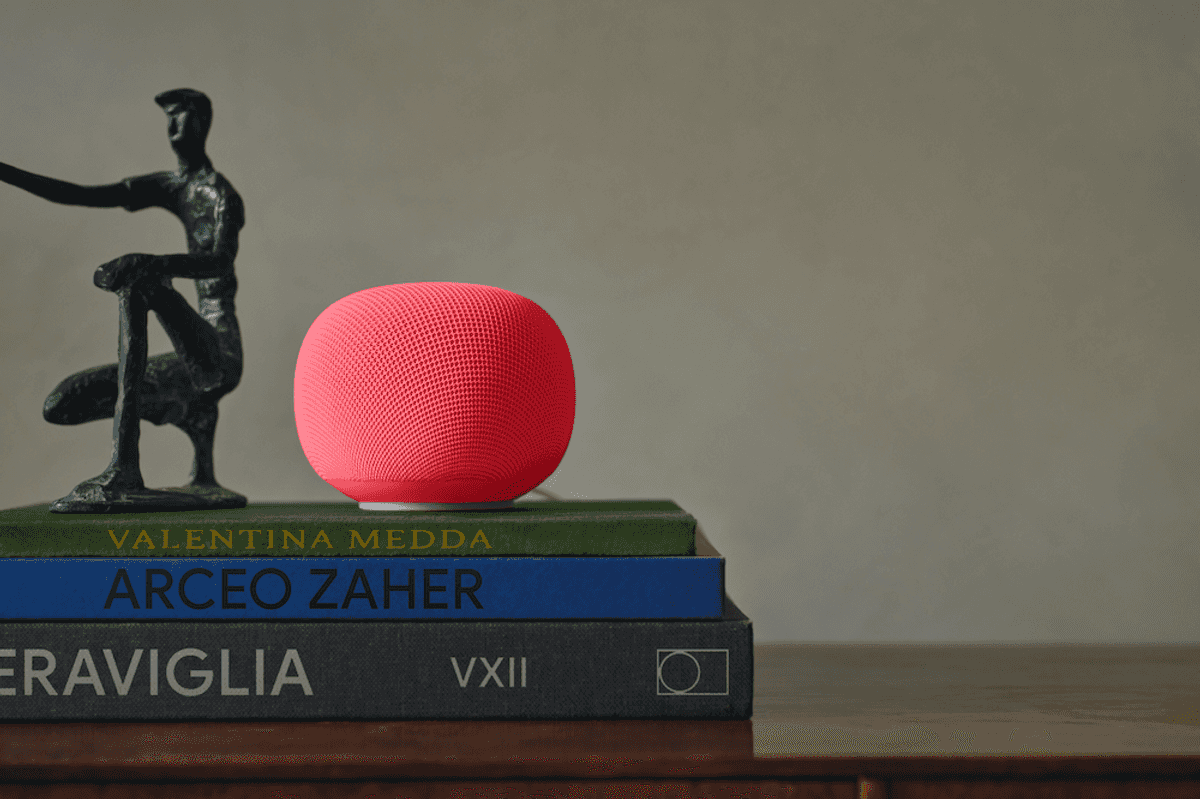 photo of Google Home Speaker on a pile of books