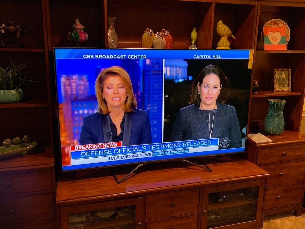 Photo of Hisense H9F 65 inch 4k smart tv with news coverage on the screen.