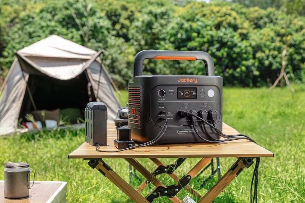 Photo of Jackery HomePower 1000 Plus V2 charging devices while camping