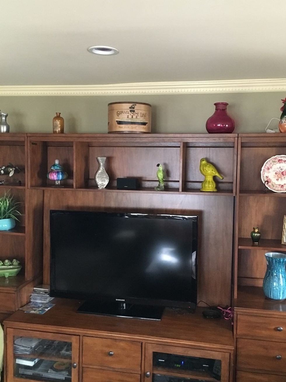 Photo of koogeek light strips off behind entertainment unit.