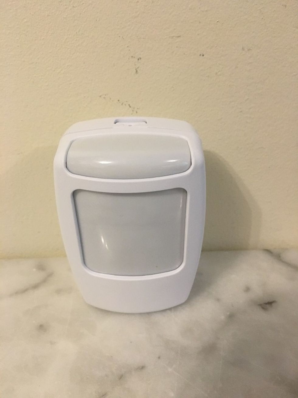 photo of Lifeshield motion sensor on a counter.