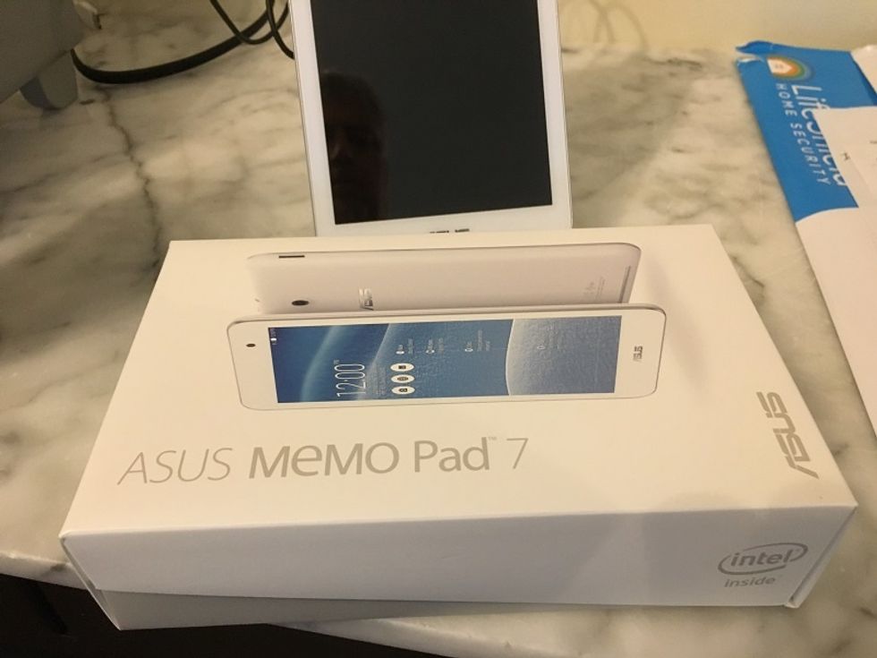 Photo of Lifeshield's wireless touchpad and it's box on a counter.